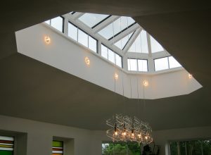 Rooflight with recessed lights at base
